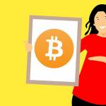 kobieta trzymające plakat Bitcoin